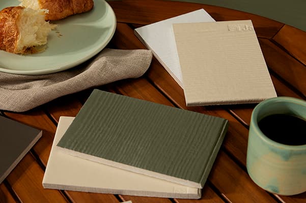 Mountain Sage Green Siding Sample Mountain Sage Green siding sample on a table
